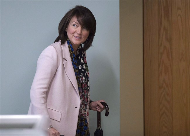 Former Quebec deputy premier Nathalie Normandeau walks to a courtroom.