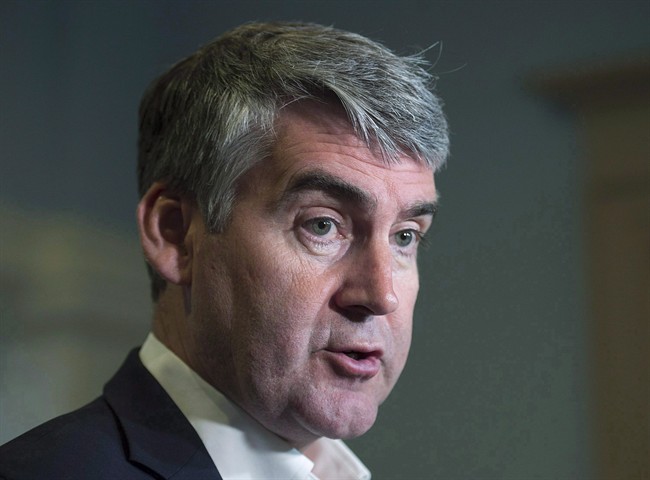 FILE - Nova Scotia Premier Stephen McNeil talks with reporters at the legislature in Halifax on Wednesday, May 31, 2017.