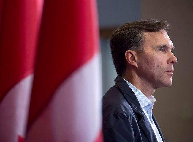 Finance Minister Bill Morneau takes questions as the Liberal cabinet meets in St. John's, N.L. on Tuesday, Sept. 12, 2017. Finance Minister Bill Morneau is putting the squeeze on federal New Democrats, chiding them for failing to support his proposals to end what he calls unfair tax advantages for some wealthy small business owners.