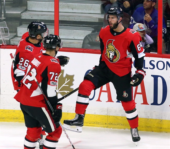 Ottawa Senators forward Tyler Randell (64) celebrates his goal against the Toronto Maple Leafs with forward Ben Sexton (26) and defenceman Thomas Chabot (72) during first period NHL preseason hockey in Ottawa on Monday, September 18, 2017. 
