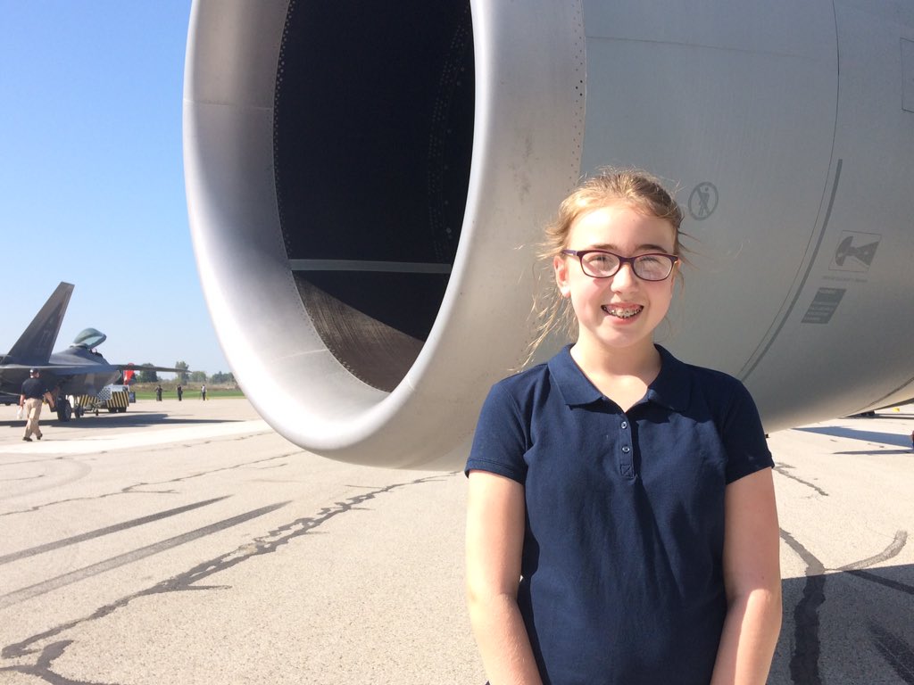 Eleven-year-old Hannah Freyer stands next to the Airbus KC-30A.
