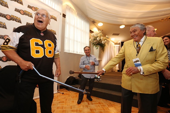 Fundraiser In Honour Of Angelo Mosca, ON- AUGUST 26 – Charles Juravinski jokes with Angelo Mosca at a Fundraiser in honour of Angelo Mosca, Ti-Cat great who has been diagnosed with Alzhiemers at the Carmen’s Banquet Centre in Hamilton. August 26, 2015. Steve Russell/Toronto Star (Steve Russell/Toronto Star via Getty Images)