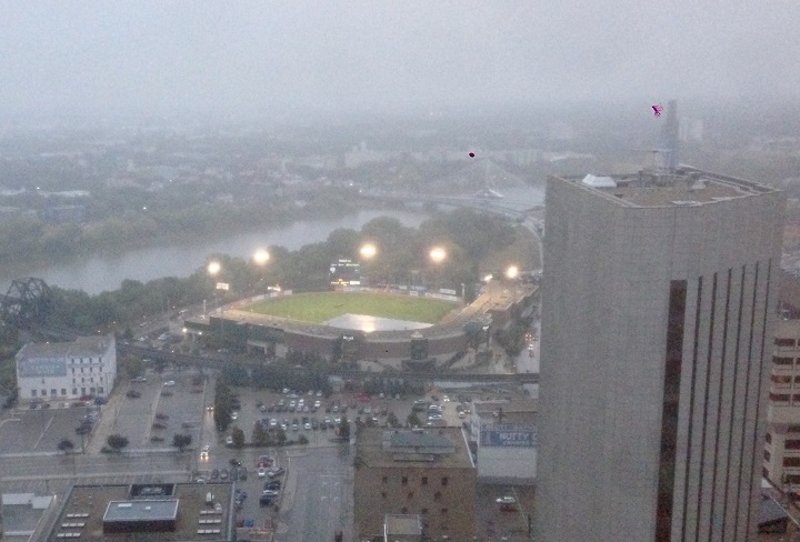 A tarp covers the diamond at Shaw Park on Saturday after the third game of the American Association championship series was rained out.