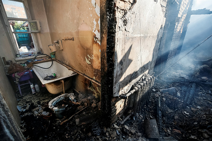 A destroyed house is seen near where a warehouse storing ammunition for multiple rocket launcher systems exploded at a military base in Kalynivka, Ukraine on September 27, 2017.