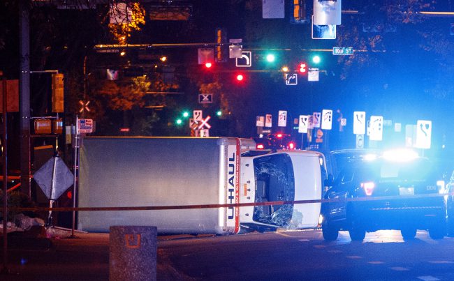 Police investigate after a U-Haul van ran into pedestrians in Edmonton, Alta., Sept. 30, 2017.