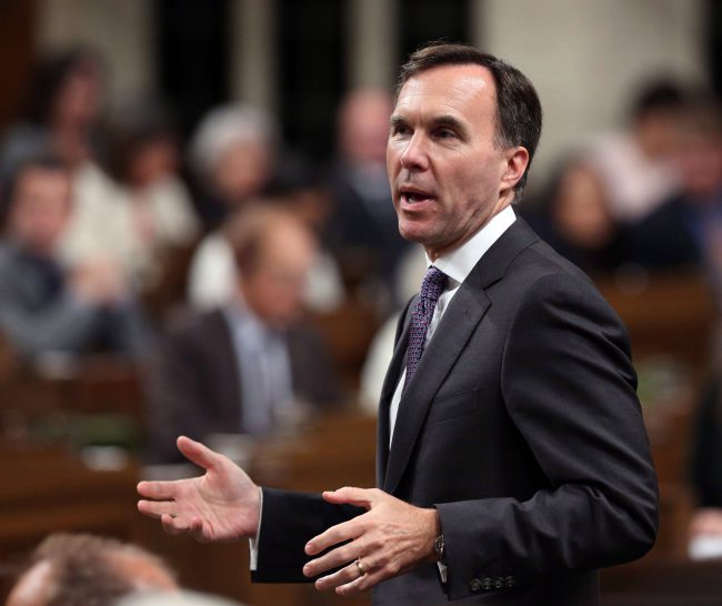 Finance Minister Bill Morneau stands up during Question Period in the House of Commons in Ottawa, Tuesday, October 3, 2017. 

