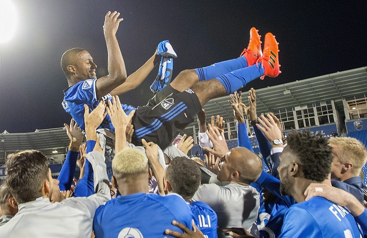 Montreal Impact’s Patrcie Bernier is lifted up by teammates following his final MLS soccer game, against the New England Revolution in Montreal, Sunday, October 22, 2017. THE CANADIAN PRESS/