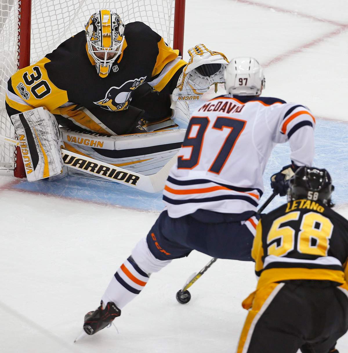 Edmonton Oilers’ Connor McDavid (97) goes to the backhand in front of Pittsburgh Penguins goalie Matthew Murray (30) with Kris Letang (58) defending in the first period of an NHL hockey game in Pittsburgh, Tuesday, Oct. 24, 2017. McDavids shot went wide. (AP Photo/Gene J. Puskar)