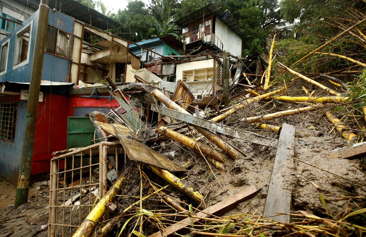Houses damaged by a mudslide are seen during heavy rains of Tropical Storm Nate in San Jose, Costa Rica, on Oct. 5.