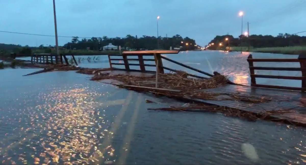 A dock pushed in by the storm blocks a flooded road in Mobile, Ala., on Oct. 8, 2017, in this still image taken from a video obtained from social media.