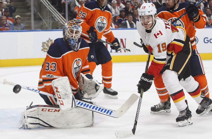 Calgary Flames’ Matthew Tkachuk (19) is stopped by Edmonton Oilers goalie Cam Talbot (33) during first period NHL action in Edmonton, Alta., on Wednesday October 4, 2017.