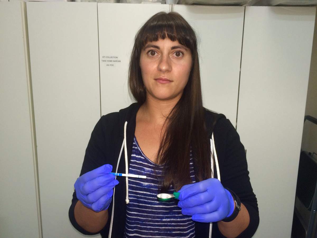 Clinical coordinator Marjory Ditmars demonstrates the test strips available at Insite.