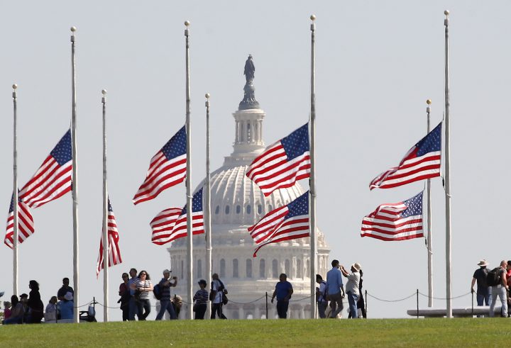 U.S. flags on the grounds of the Washington Monument are lowered to half-staff, on Oct. 2, 2017 in Washington, DC.