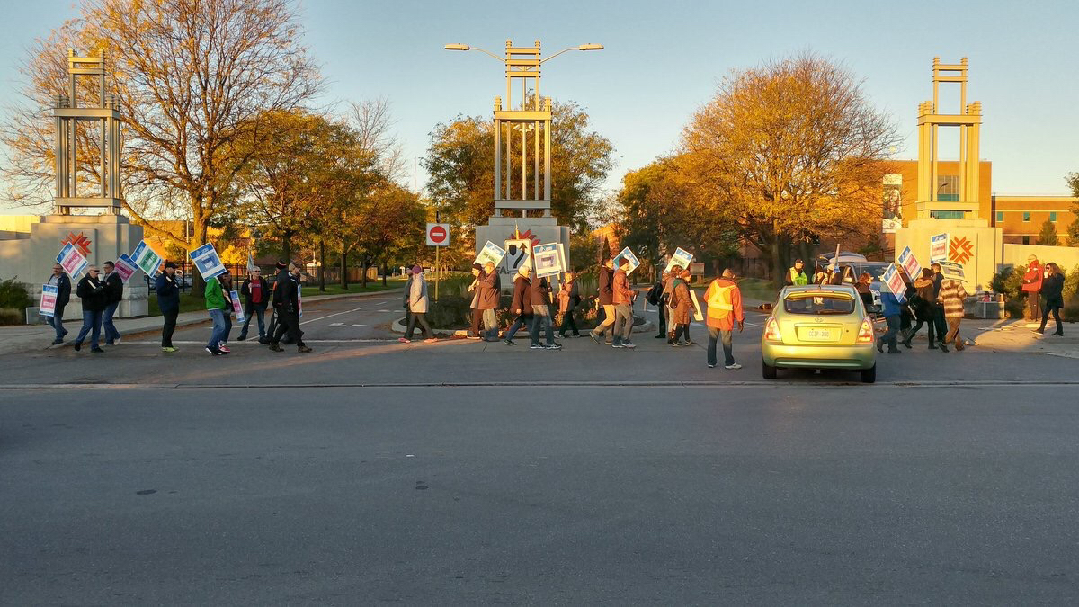 Striking faculty members picket outside Fanshawe College on Oct 16, 2017.