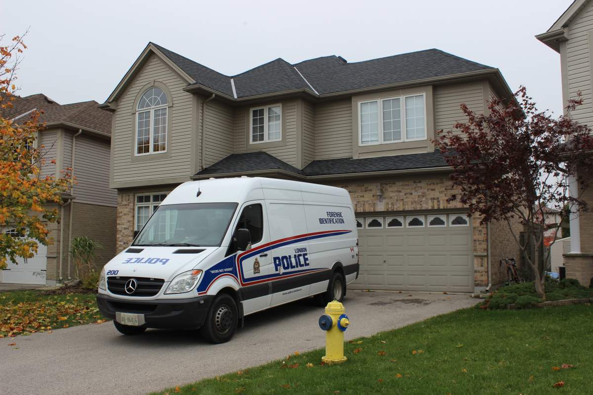 A London police forensics van can be seen outside the house where Glenn’s remains were found, in this photo from Oct. 30, 2017.