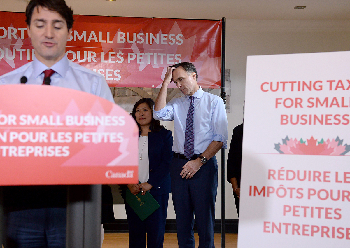 Finance Minister Bill Morneau looks on as Prime Minister Justin Trudeau speaks to members of the media at a press conference in Stouffville, Ont., on Monday, October 16, 2017. 