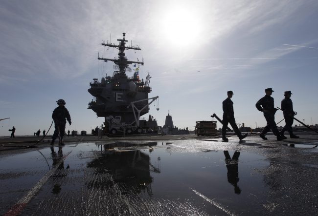Sailors prepare for the deployment of the nuclear aircraft carrier USS Enterprise at the Norfolk Naval Station in Norfolk, Va., March 8, 2012.