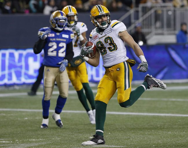 Edmonton Eskimos' Brandon Zylstra (83) celebrates his touchdown against the Winnipeg Blue Bombers during second half CFL western semifinal action in Winnipeg, Nov. 12, 2017. 