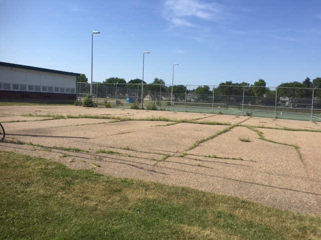 The Allendale Community League wanted to turn this unusable asphalt pad into a community garden.
