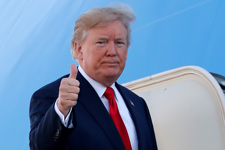 U.S. President Donald Trump boards Air Force One for travel to Hawaii, on his way to an extended trip to five countries in Asia, from Joint Base Andrews, Maryland, November 3, 2017. 