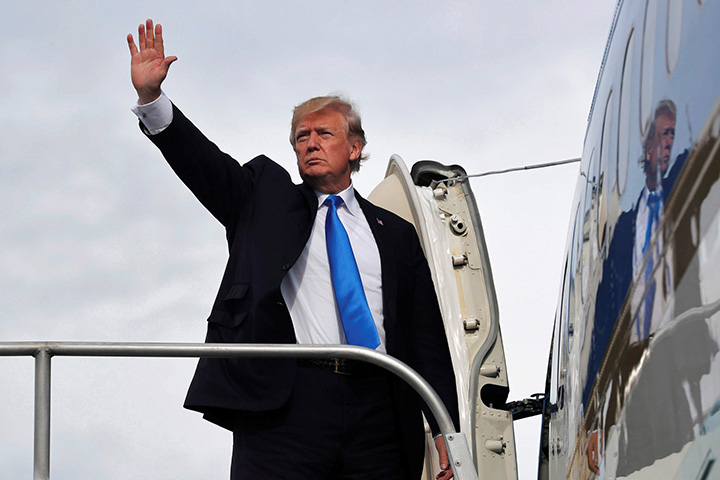 U.S. President Donald Trump boards Air Force One on November 14, 2017.  