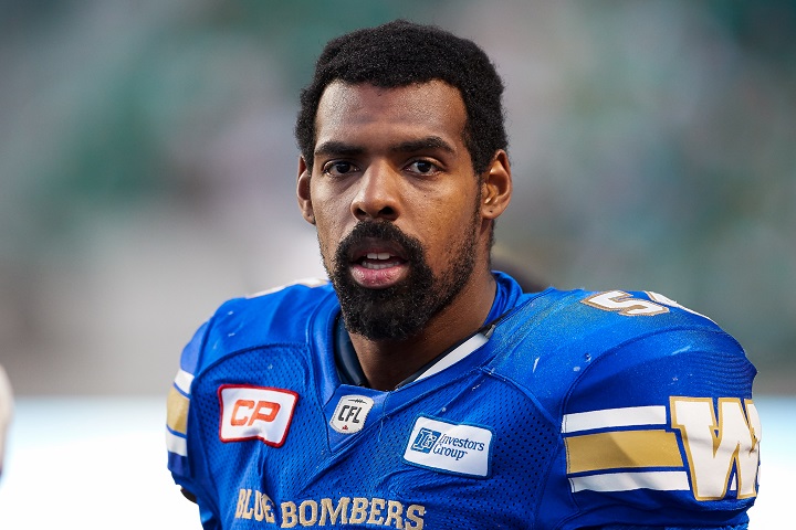 Tristan Okpalaugo of the Winnipeg Blue Bombers stands on the sideline during a pre-season game against the Saskatchewan Roughriders at Mosaic Stadium on June 10 in Regina.