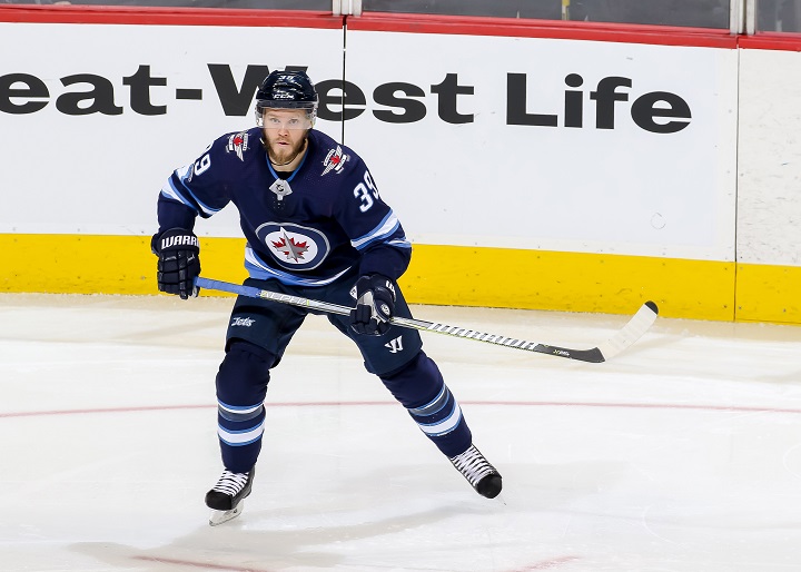 Toby Enstrom of the Winnipeg Jets keeps an eye on the play during a game against the Montreal Canadiens at Bell MTS Place on Nov. 4 in Winnipeg.