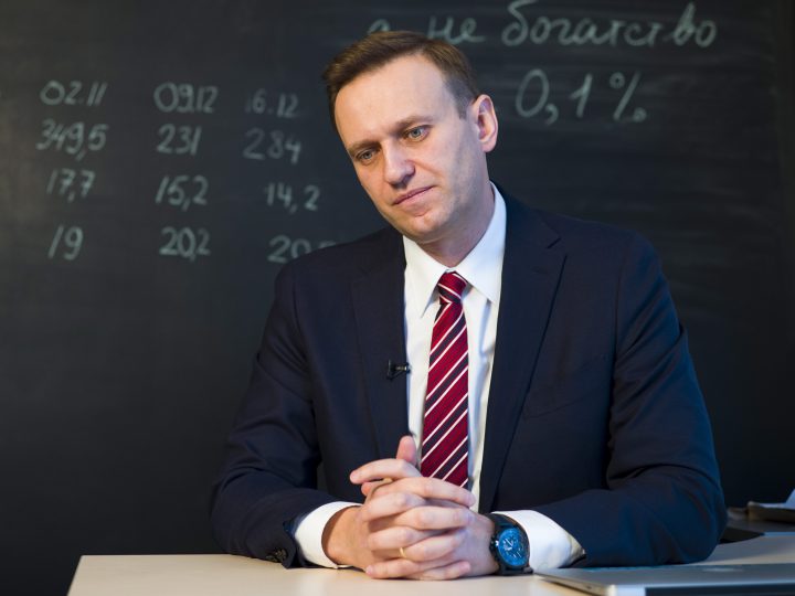 FILE - Russian opposition politician Alexei Navalny listens to a question during his interview to the Associated Press in Moscow, Russia, Monday, Dec. 18, 2017.
