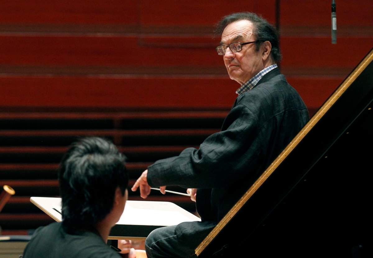 In this Oct. 19, 2011 file photo, world-renowned conductor Charles Dutoit, right, performs with the Philadelphia Orchestra during a rehearsal in Philadelphia. Four women have accused Dutoit of sexual misconduct that allegedly occurred on the sidelines of rehearsals or performances with some of America’s great orchestras. The 81-year-old is the artistic director and principal conductor at London’s Royal Philharmonic Orchestra.