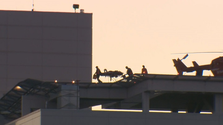 In this file photo an air ambulance lands on the roof of a hospital. Quebec announced pilot project to transfer patients by air.