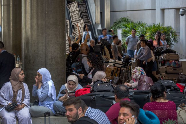 Activists demonstrate as international travelers arrive at Los Angeles International Airport, June 29, 2017 in Los Angeles, California. 



