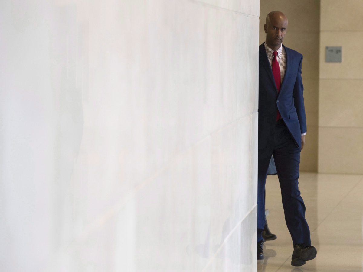 Minister of Immigration, Refugees and Citizenship Ahmed Hussen makes his way to appear before the Commons Citizenship and Immigration committee in Ottawa, Thursday November 23, 2017. 