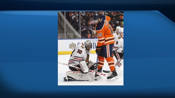 Chicago Blackhawks goalie Jeff Glass (30) makes the save on Edmonton Oilers' Patrick Maroon (19) during second period NHL action in Edmonton on Friday December 29, 2017. 