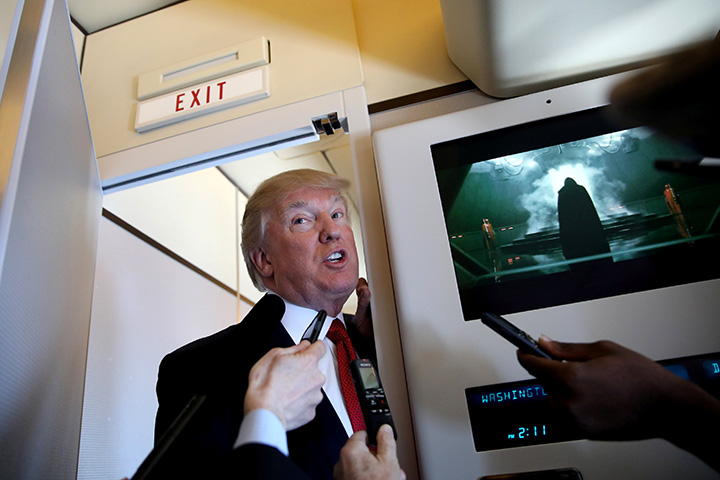 U.S. President Donald Trump talks to journalists on board Air Force One during his trip to Palm Beach, Florida, April 6, 2017.