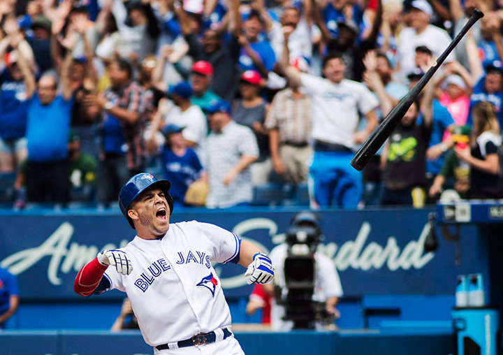 Toronto Blue Jays Steve Pearce throws the bat in celebration after hitting a walk off grand slam to beat the Oakland Athletics during the 10th inning in Toronto, Thursday July 27, 2017. 