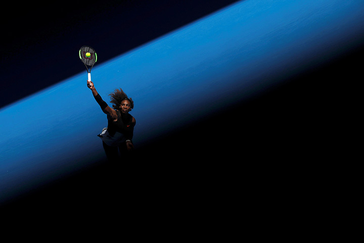 Serena Williams serves during the Australian Open at Melbourne Park, January 21, 2017.