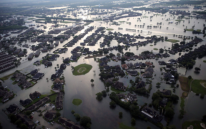 Floodwaters from Tropical Storm Harvey surround homes in Port Arthur, Texas, on Aug. 31, 2017.