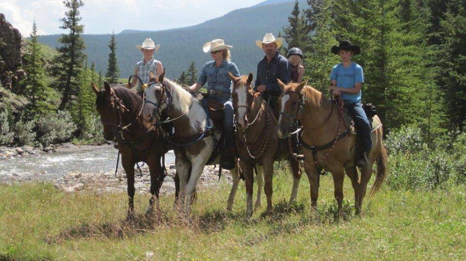The Cameron family riding some of the horses which were stolen from their central Alberta ranch near Winfield, Alta.