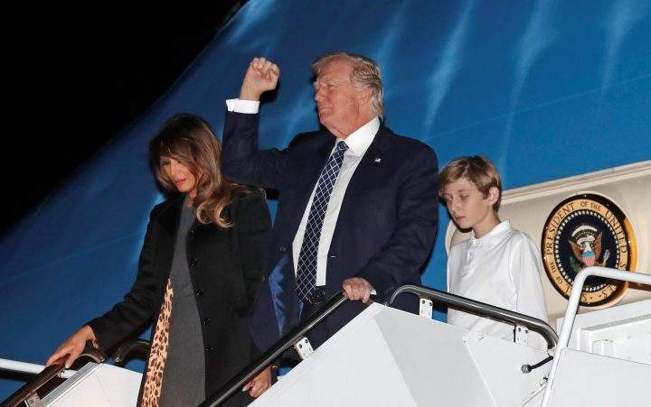 U.S. President Donald Trump, first lady Melania Trump and their son Barron step out from Air Force One on Jan. 12.