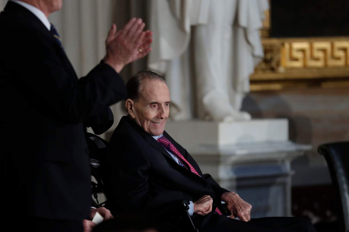 Former Senate majority leader Bob Dole is applauded as he arrives in the Capitol Rotunda for a Congressional Gold Medal ceremony held in his honor in Washington, U.S., January 17, 2018.