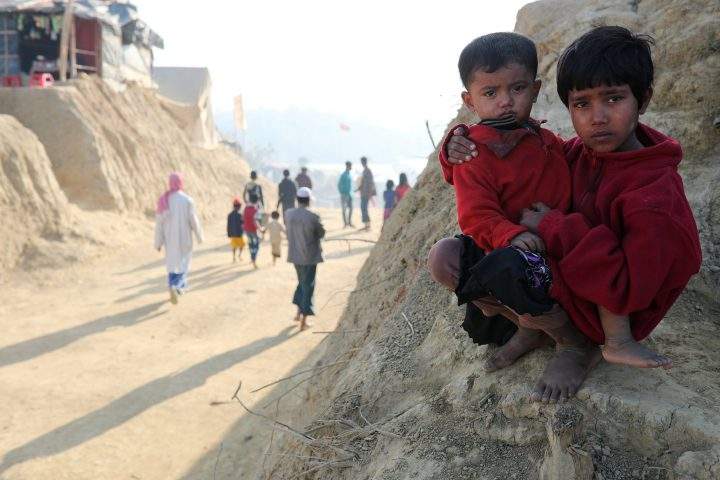 Rohingya refugee children look on at the Jamtoli camp in the morning in Cox's Bazar, Bangladesh, Jan. 22, 2018. 