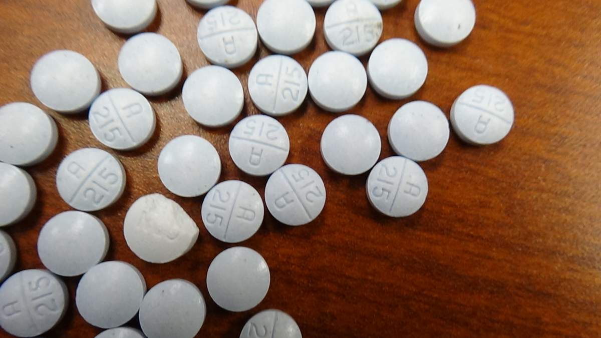 Cobourg police say officers seized a quantity of fentanyl and a knife from a local man who had a warrant out for his arrest.