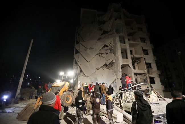 Syrian emergency personnel search for victims following an explosion in a rebel-held area of the northwestern city of Idlib on Jan. 7, 2018.