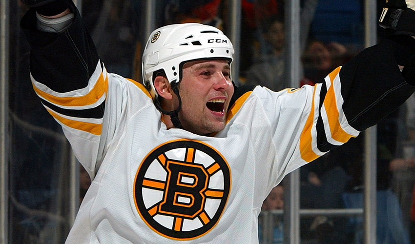 Marc Savard celebrates a goal with the Boston Bruins in 2009. Savard retired on Monday after 13 seasons in the NHL which was cut short in 2011 by a major concussion.