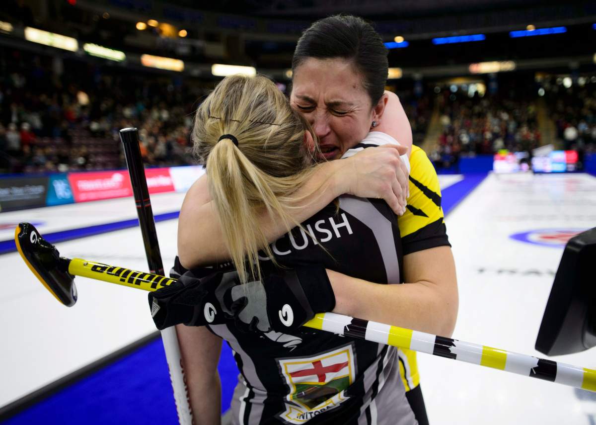Manitoba second Jill Officer, left, hugs her niece Wild Card lead Kristin MacCuish after defeating her to take the win at the Scotties Tournament of Hearts in Penticton, B.C., on Sunday, Feb. 4, 2018.