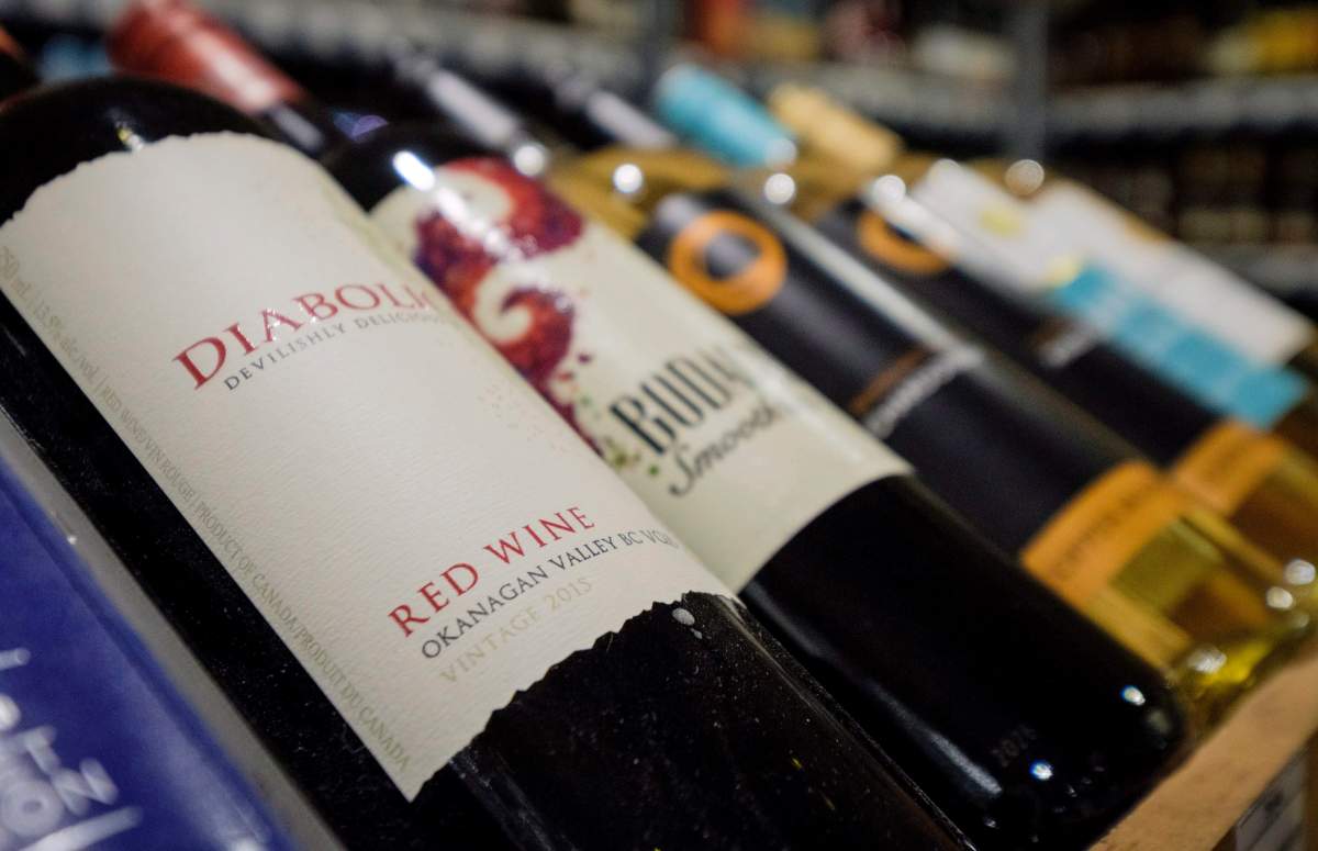 Bottles of British Columbia wine on display at a liquor store in Cremona, Alta., Wednesday, Feb. 7, 2018. Alberta is banning the import of British Columbia wines in response to what Alberta Premier Rachel Notley sees as moves to try to scuttle the Trans Mountain pipeline project. THE CANADIAN PRESS/Jeff McIntosh.