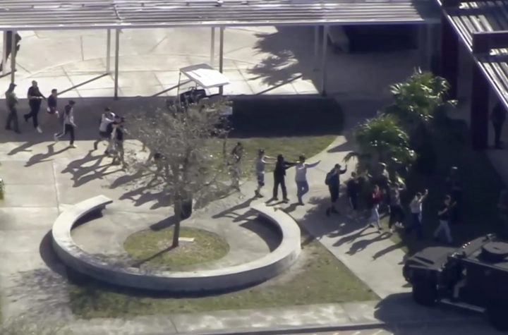 In this frame grab from video provided by WPLG-TV, students from the Marjory Stoneman Douglas High School in Parkland, Fla., evacuate the school following a shooting there on Wednesday, Feb. 14, 2018.