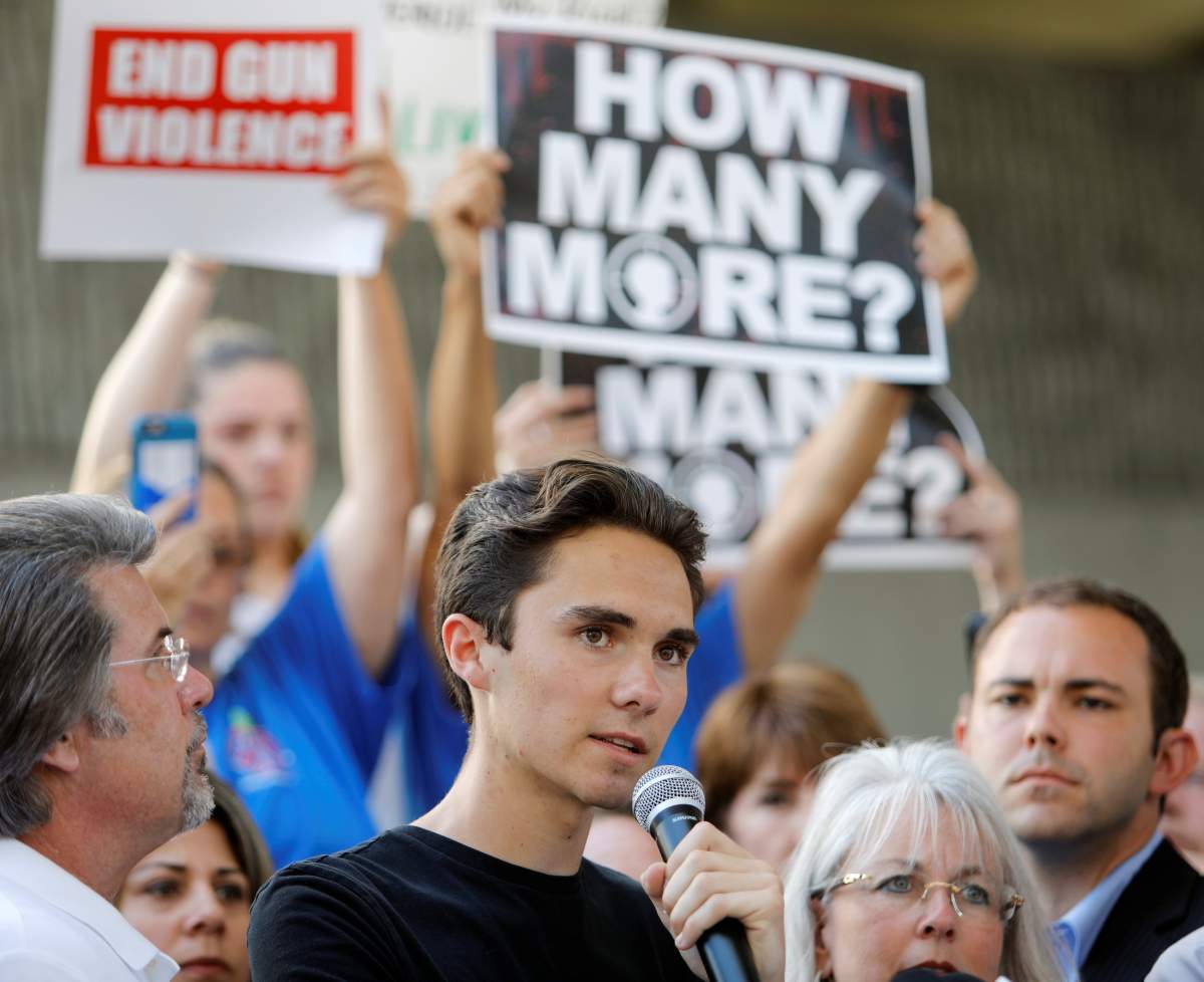 David Hogg, a senior at Marjory Stoneman Douglas High School, speaks at a rally calling for more gun control three days after the shooting at his school, in Florida.