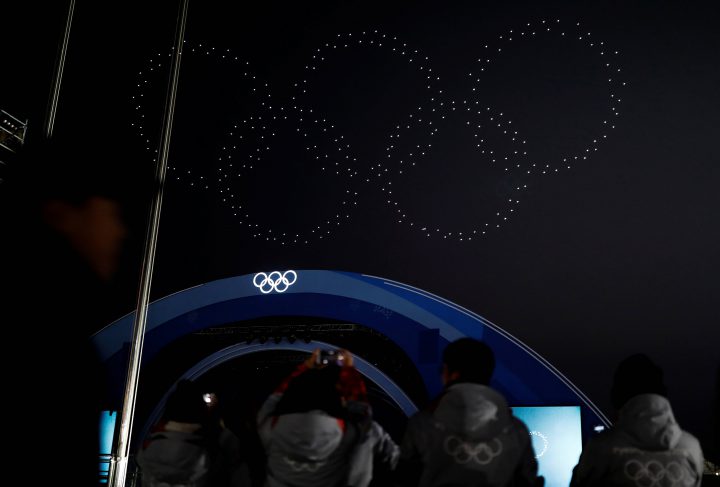 Drones in the formation of the Olympic rings fly over the Medals Plaza in Pyeongchang, South Korea, Feb. 18, 2018.