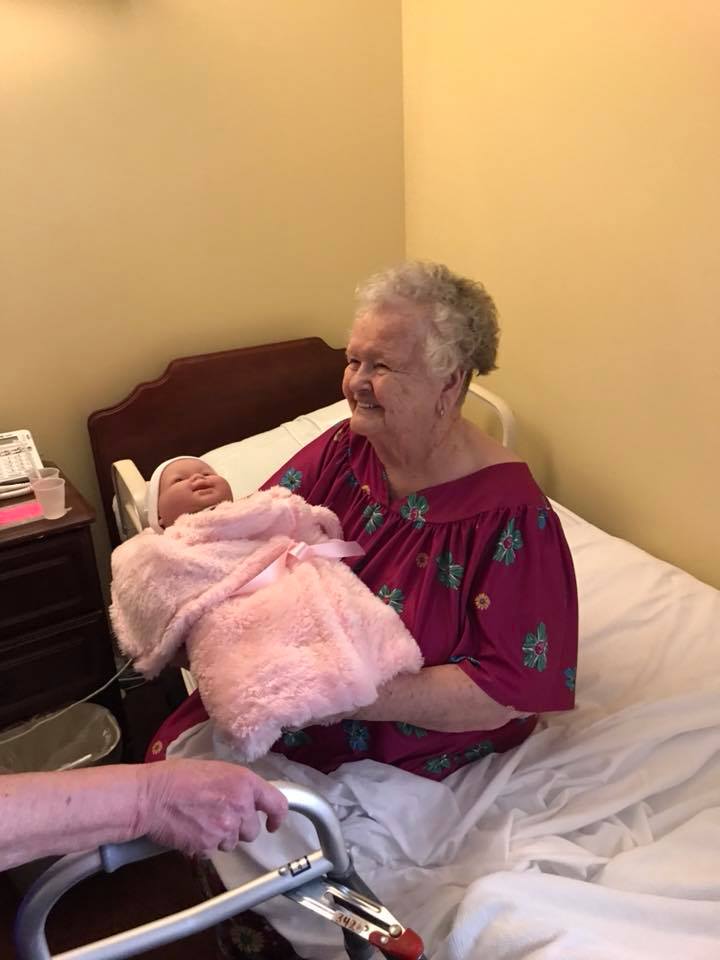 Alzheimer’s patients light up after receiving dolls and plush puppies for therapy - image